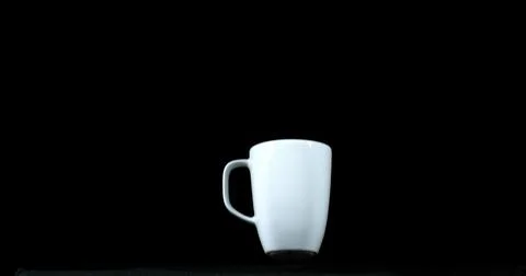 Cup falling on Black Background 스톡 사진