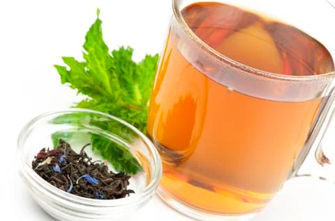 Cup of flavored black tea Stock Photos