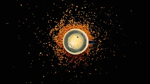 Cup Of Fresh Coffee Seen Rotating with Coffee Beans Power On Top View. Stock Footage 152553433