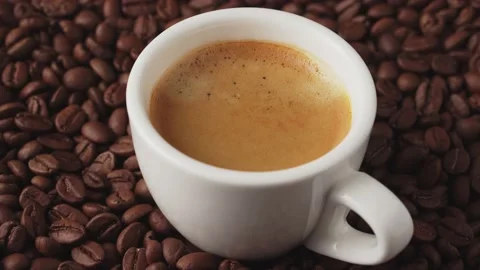 Cup of freshly brewed aromatic coffee with coffee beans, rotate. Stock Footage 169597687