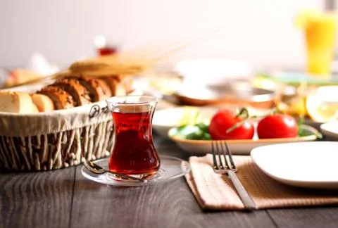 A cup of freshly-fermented tea for breakfast with bread wheat Stock Photos