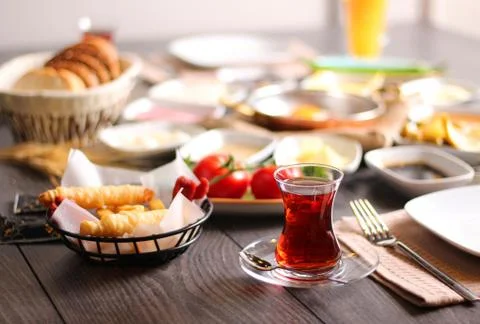 A cup of freshly-fermented tea for breakfast with bread wheat tomato cheese s Stock Photos