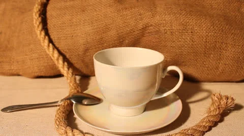 Cup of fried fragrant coffee in grains for a grinding Stock Footage 23937698