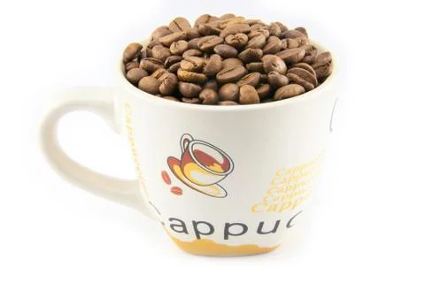 Cup full of coffee beans isolated Stock Photos