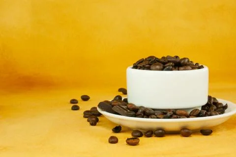 Cup full with coffee beans Stock Photos