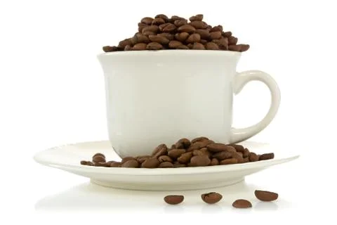 Cup full of coffee beans Stock Photos