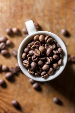 Cup full of coffee beans Stock Photos