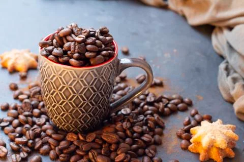 Cup full of coffee beans Stock Photos