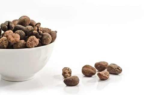 Cup full of shea nuts Stock Photos