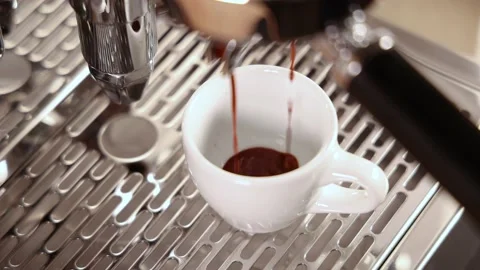 Cup getting filled with espresso coffee Stock Footage 188489545
