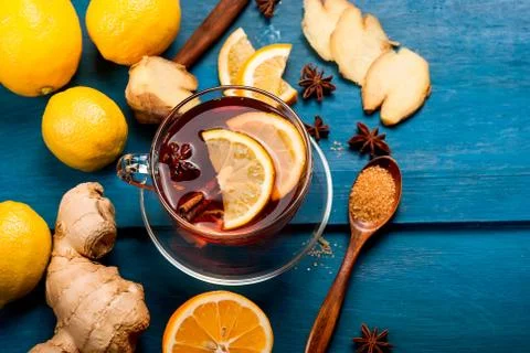 Cup of Ginger tea with lemon and honey on dark blue background, Photos