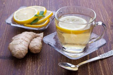 Cup of Ginger tea with lemon Stock Photos