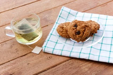 Cup glass of green tea and cookies Stock Photos
