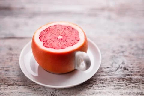 Cup from a grapefruit Stock Photos