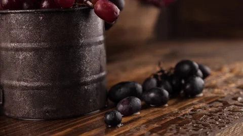 Cup of grapes under falling water Stock Footage 137411596