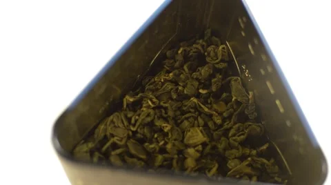 Cup with green tea and green leaves Stock Footage 57300611