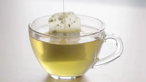 Cup of green tea isolated on white Video stock 164986752