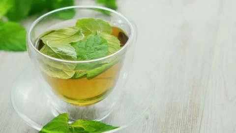 Cup of green tea with mint and lemon Stock Footage 139775165