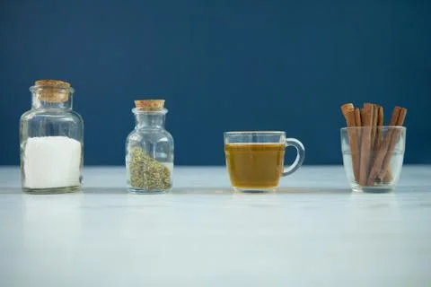 A cup of herbal tea and cinnamon sticks Stock Photos
