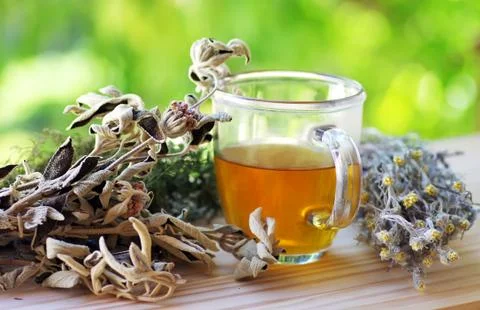 Cup of herbal tea on table Stock Photos