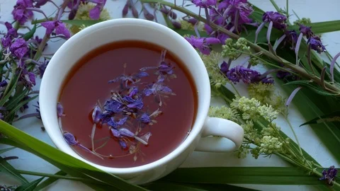 Cup of herbal tea . Tea leaves at the bottom of the cup. Vidéo 111237261