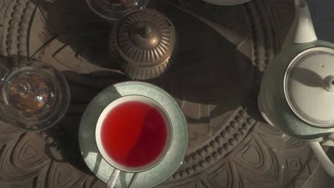 Cup of hibiscus tea on the table 動画素材 219686308