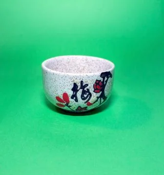 Cup with a hieroglyph on a green background Stock Photos