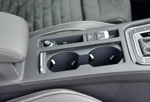 Cup holder between the front seats in the car Stock Photos