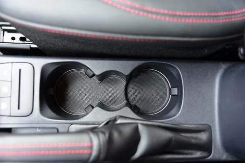 Cup holder between the front seats in the car Stock Photos