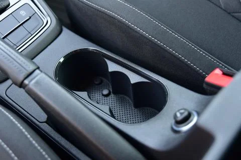 Cup holder between the front seats in the car Stock Photos