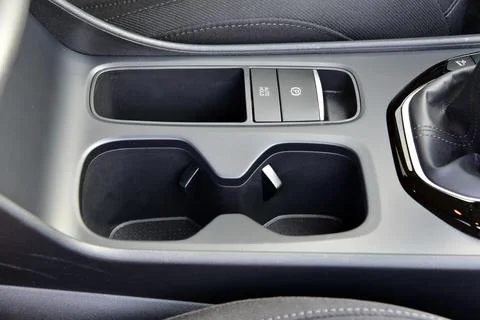 Cup holder between the front seats in the car Stock Photos