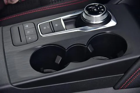 Cup holder between the front seats in the car Stock Photos