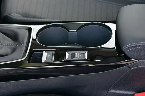Cup holder between the front seats in the car Stock Photos