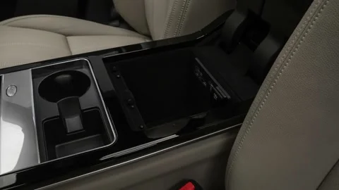 Cup holder close up in car interior  2018 Land Rover Range Rover Velar S Stock Footage 159981104