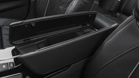 Cup holder close up in car interior  2019 BMW 5-series M550i xDrive Stock Footage 160024554