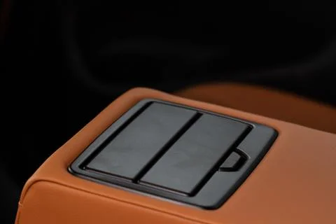 Cup holders inside modern car interior. Interior view of modern car. Stock Photos