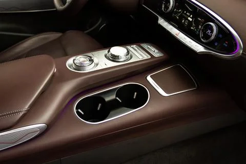 Cup holders inside modern car interior. Interior view of modern car. Stock Photos