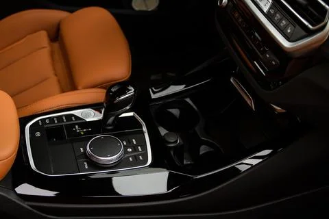 Cup holders inside modern car interior. Interior view of modern car. Stock Photos