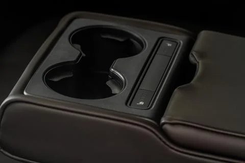 Cup holders inside modern car interior. Interior view of modern car. Stock Photos