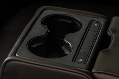 Cup holders inside modern car interior. Interior view of modern car. Stock Photos