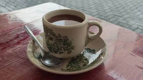 Cup holds dark brew coffee Stock Footage 331284005