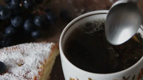 Cup of hot black leafy tea Stock Footage