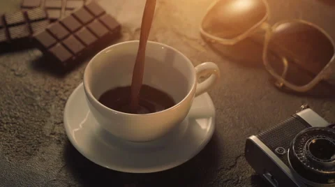 Cup of hot chocolate with retro camera and sunglasses Stock Footage 65742617