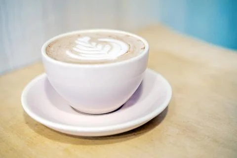 Cup of hot cocoa with a leaf pattern. earth day support green Stock Photos