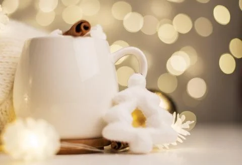 Cup of hot cocoa with marshmallows, background with Christmas lights of bokeh Stock Photos