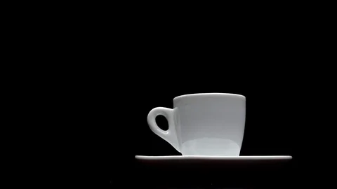 A cup of hot coffee on a black background Stock Footage 91087155