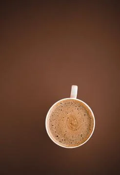 Cup of hot coffee as breakfast drink, flatlay cups on brown background Stock Photos