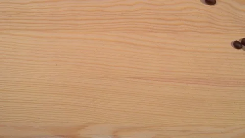 Cup of hot coffee is drawn from coffee beans on a wooden background. Stock Footage 70398581
