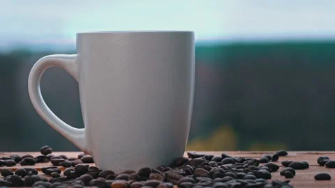 Cup of Hot Coffee Stands by the Open Window and Releases Steam Against the Sky Stock Footage 182887465