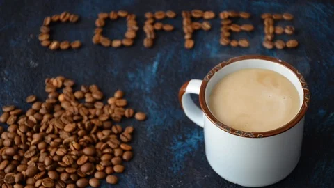 Cup of hot coffee with steam on dark blue background 動画素材 101151083